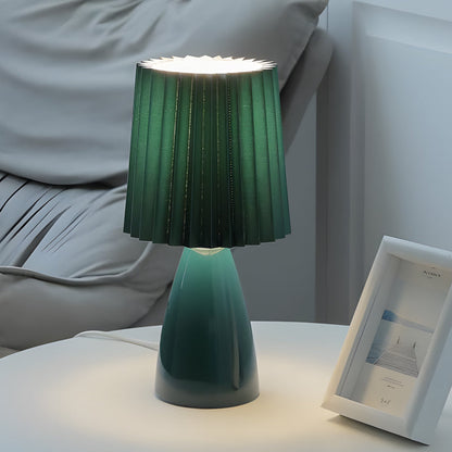 Lámpara de mesa elegante de tela con base de vidrio y toma USB